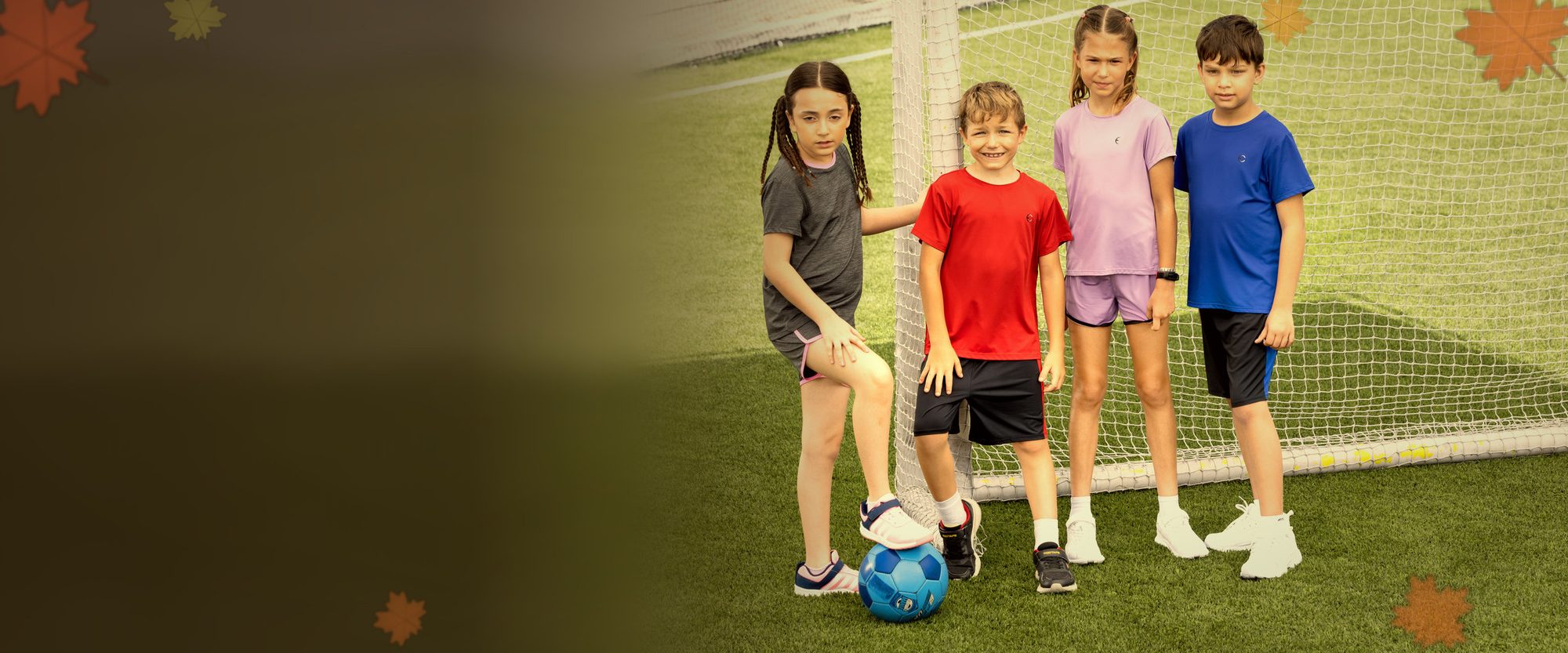 Kids in Essenclo tees and shorts on the soccer field